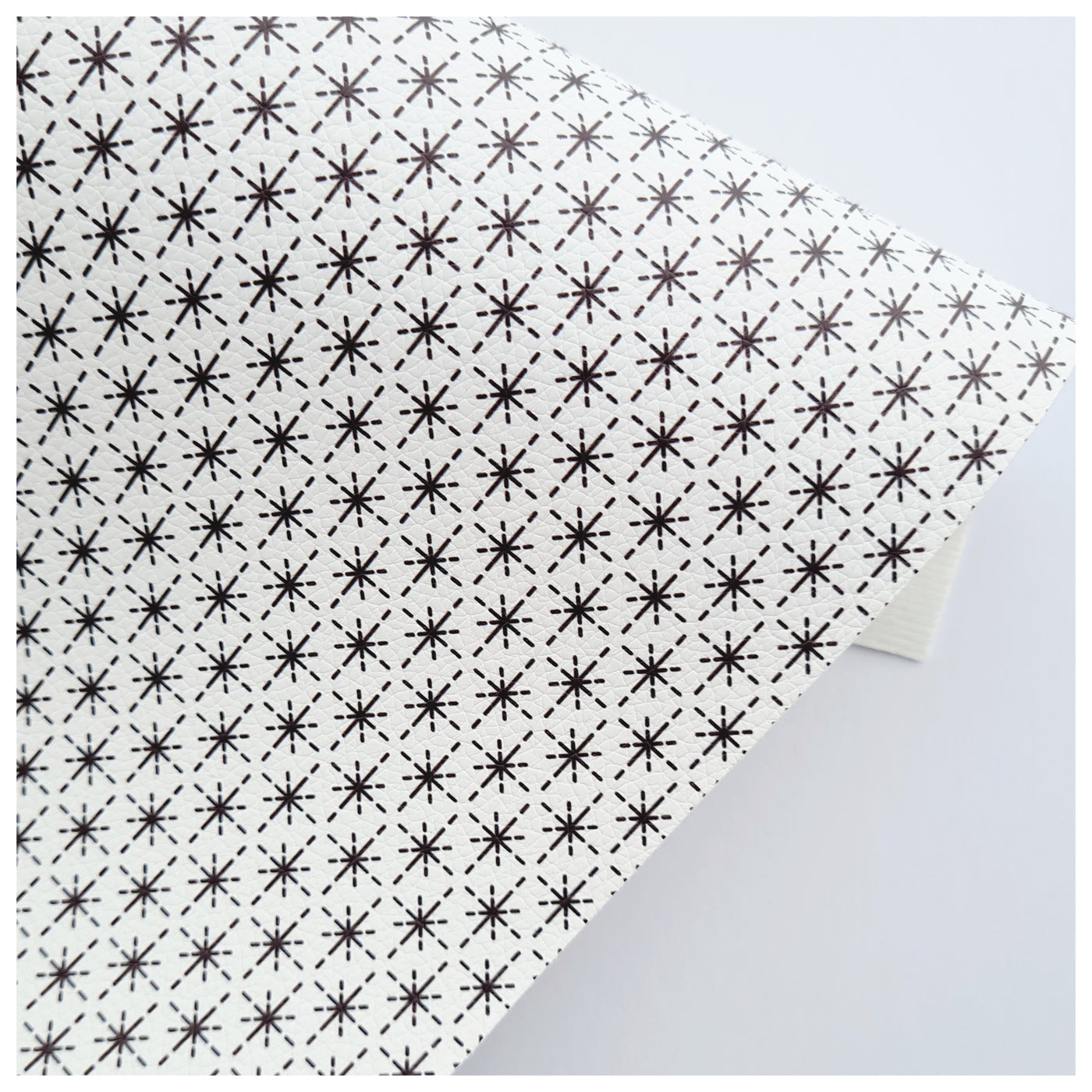 A4 Sheet of Black Starburst on White Litchi Leather